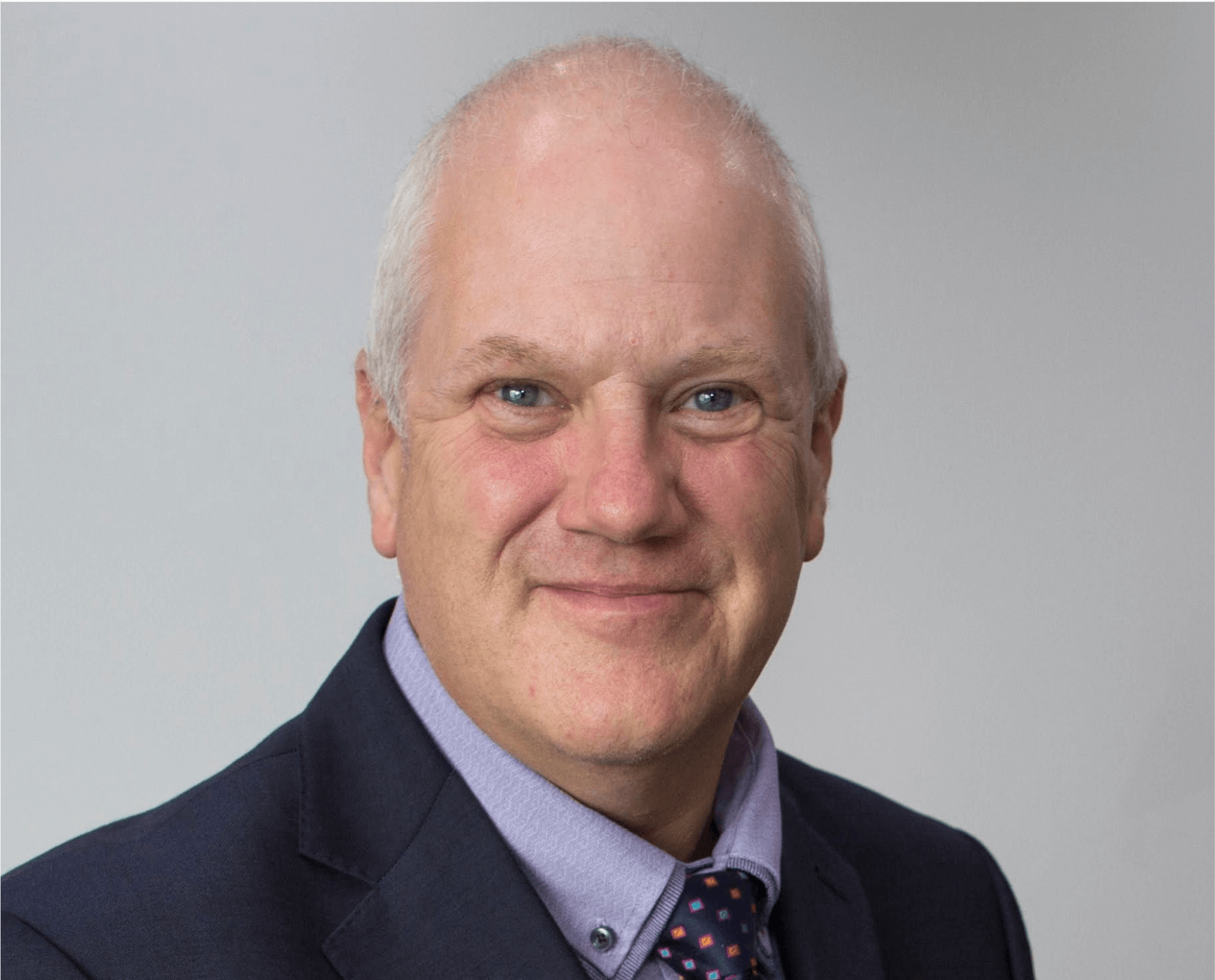 Portrait of a person in a business suit.