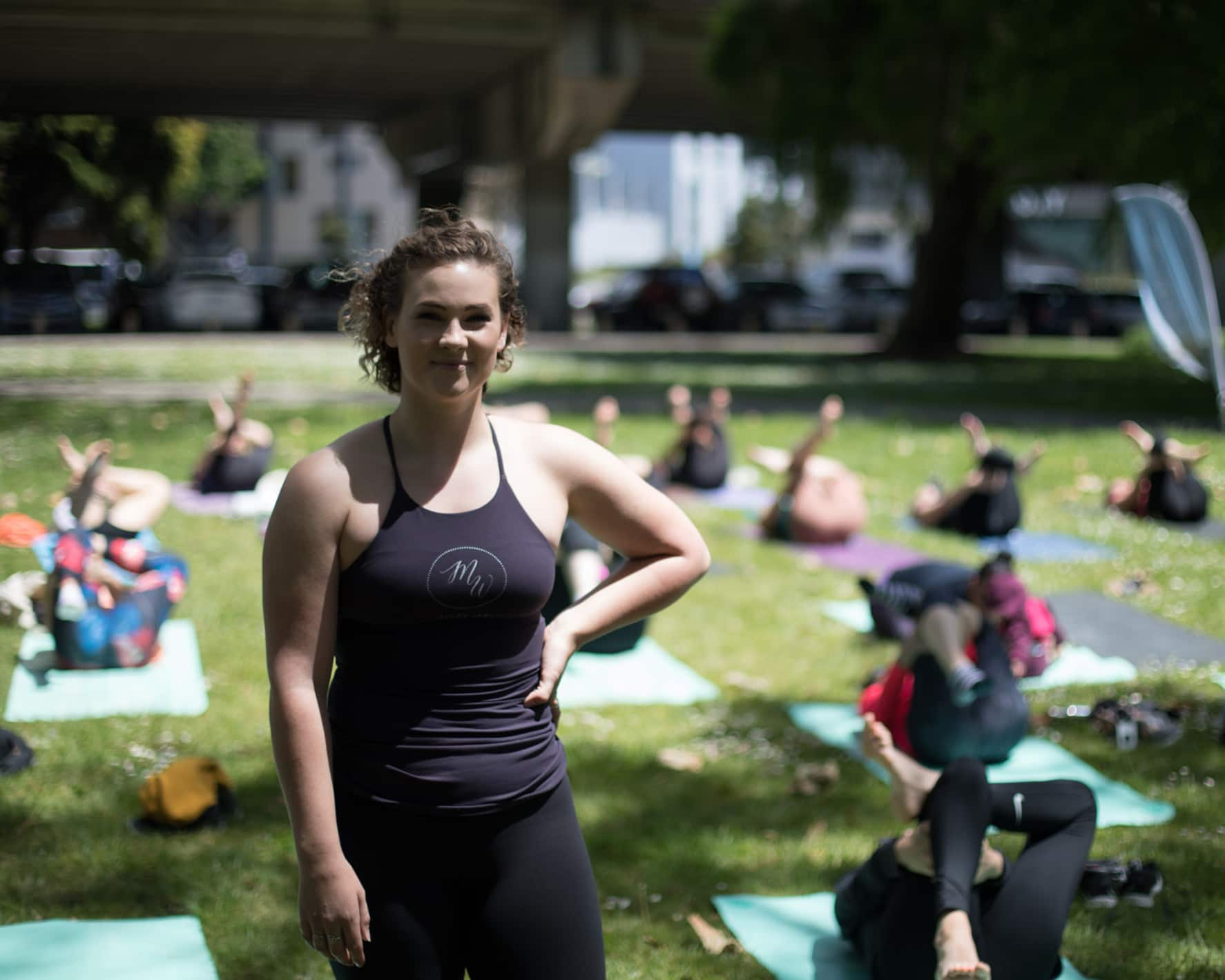 Pheobe Heyhoe from MatWorks pilates standing proud in front of her class