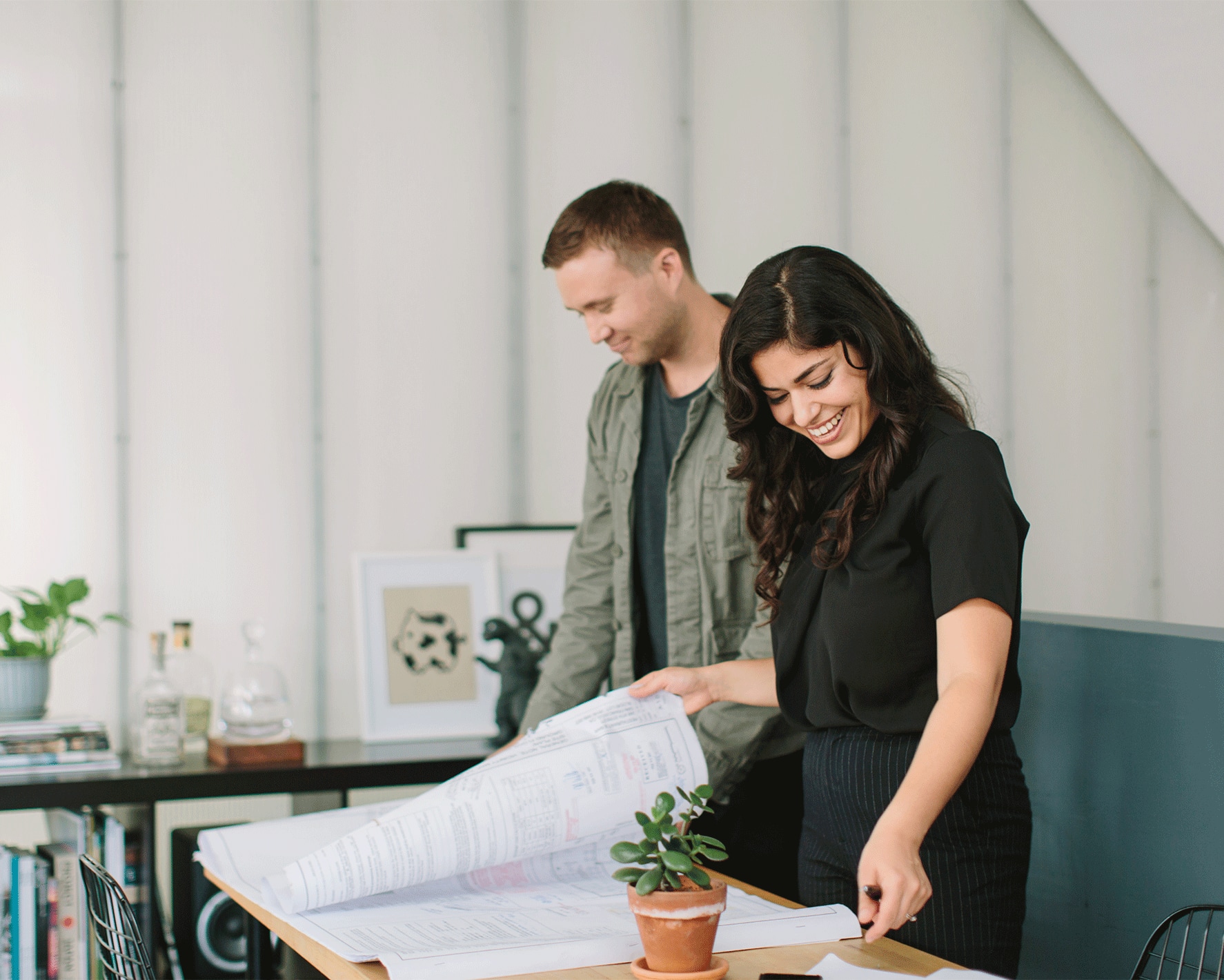 Two people looking at architecture plans