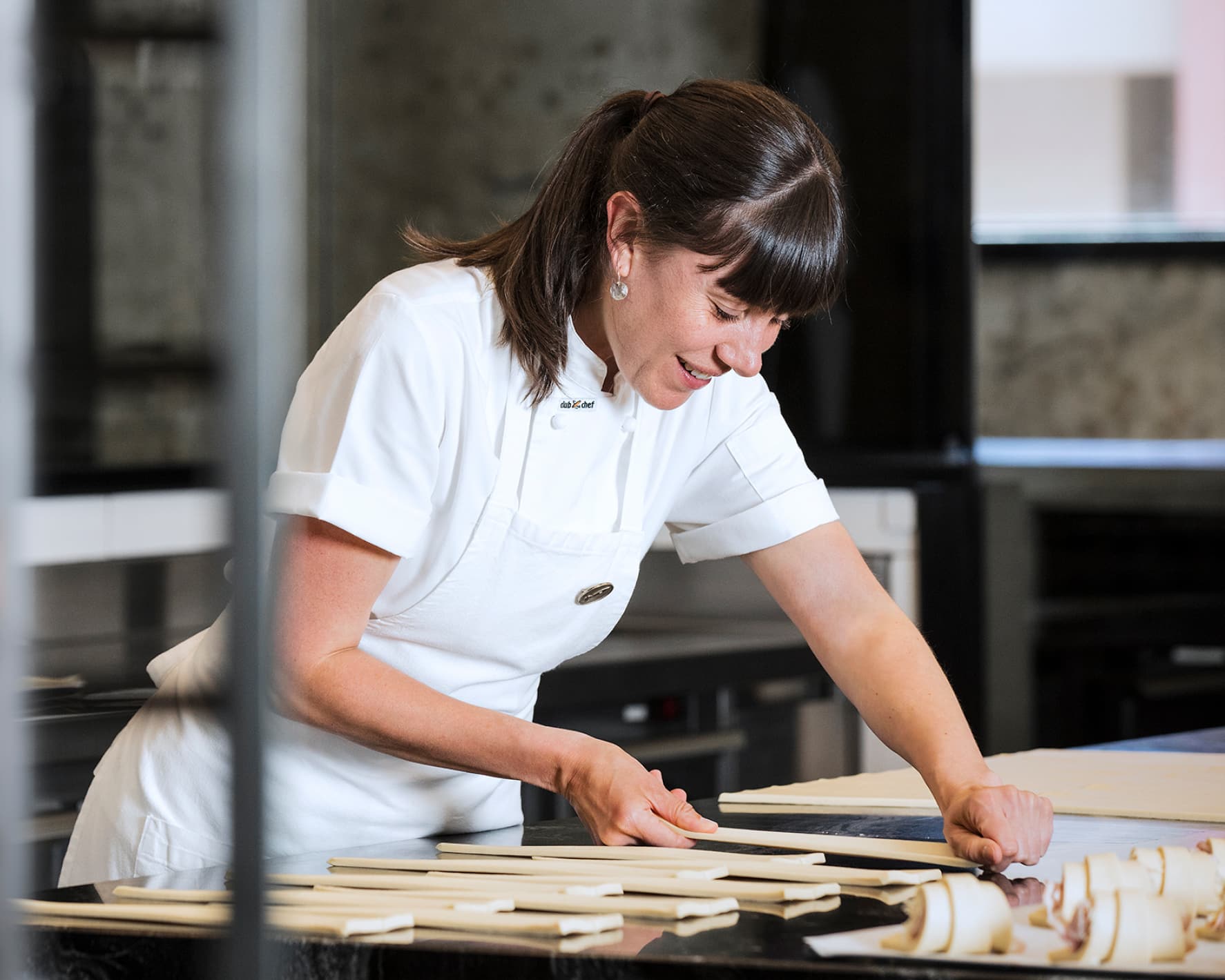 Two bakers preparing dough.