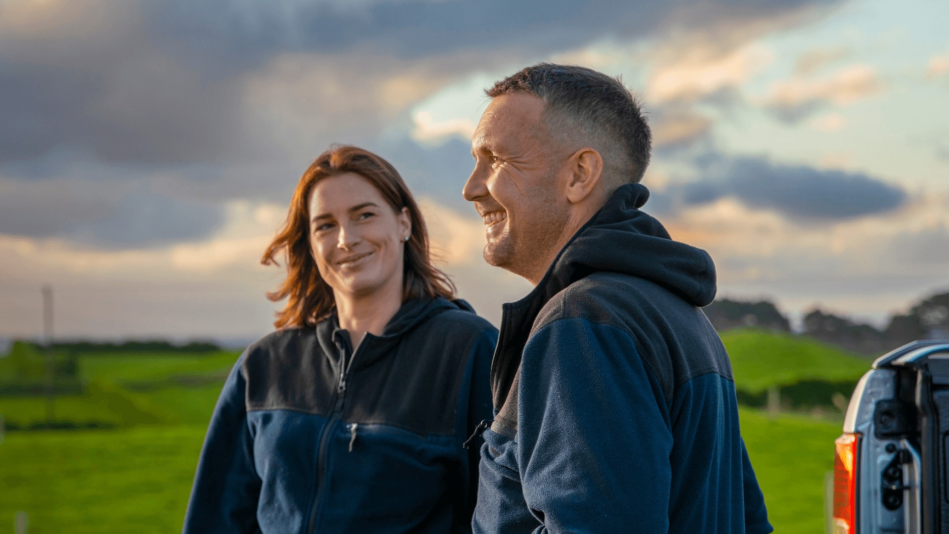 Two farmers in a paddock