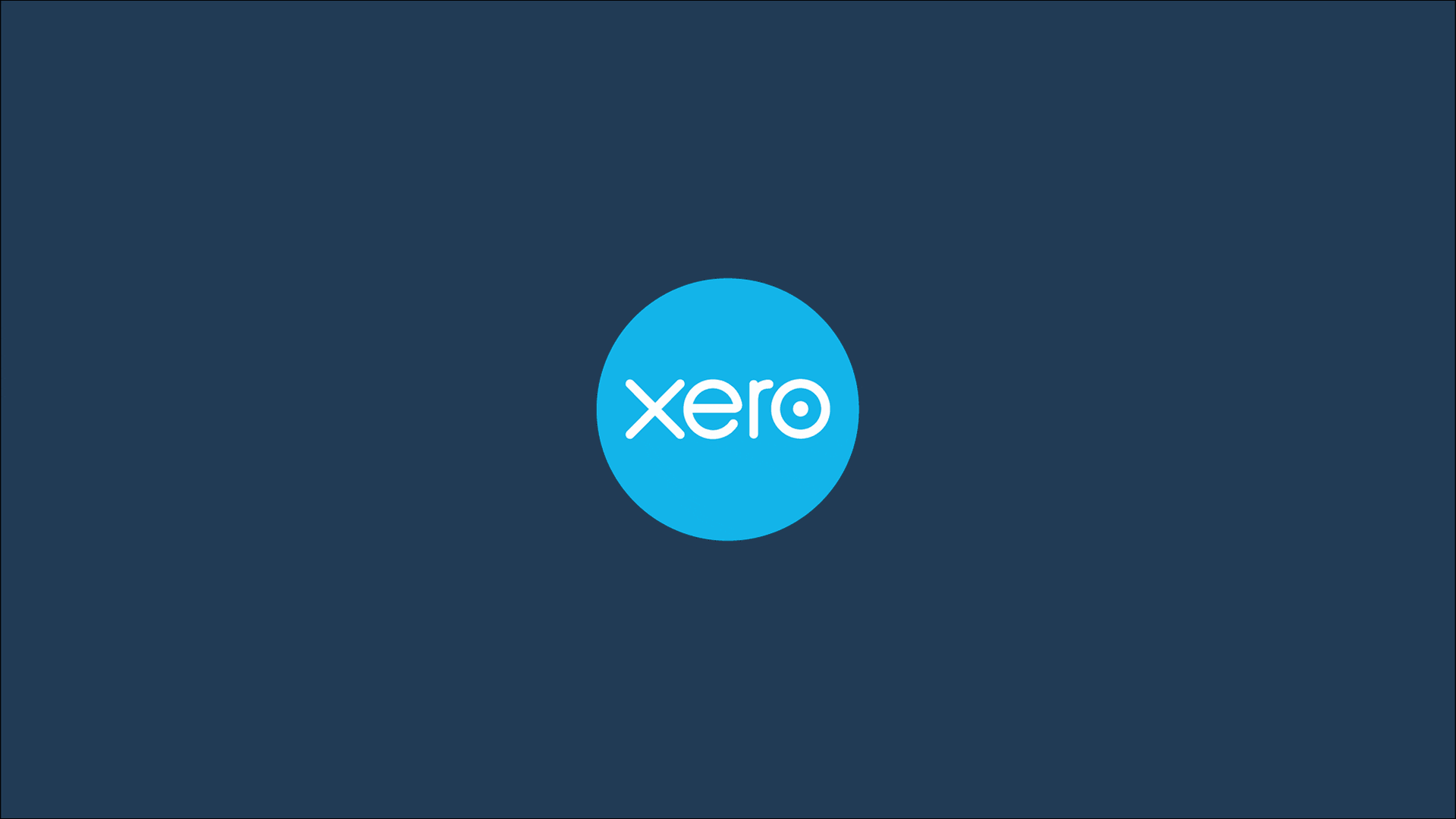 Two junior accountants sit across from each other, using Xero software to prepare client tax returns for filing.