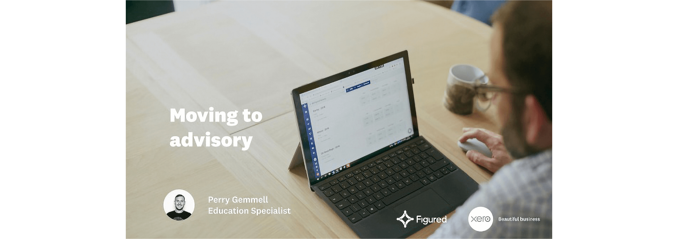 Moving to advisory video still. An advisor works with Xero on a laptop computer.