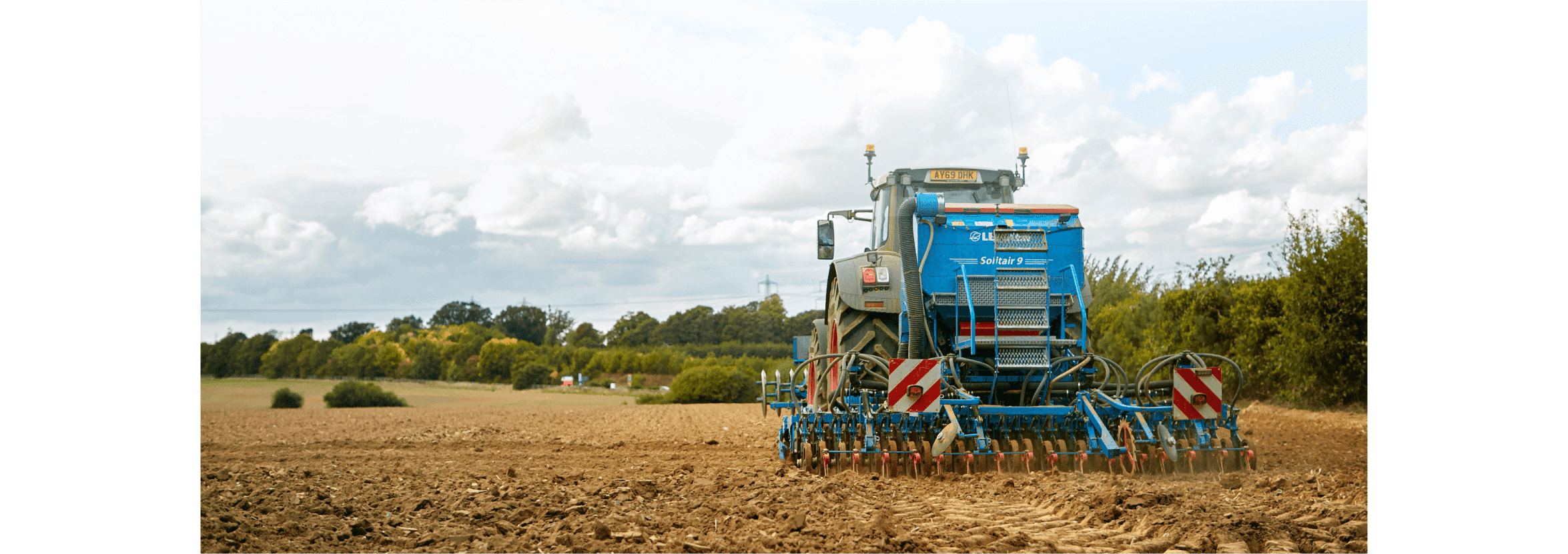 A tractor ploughing a field.