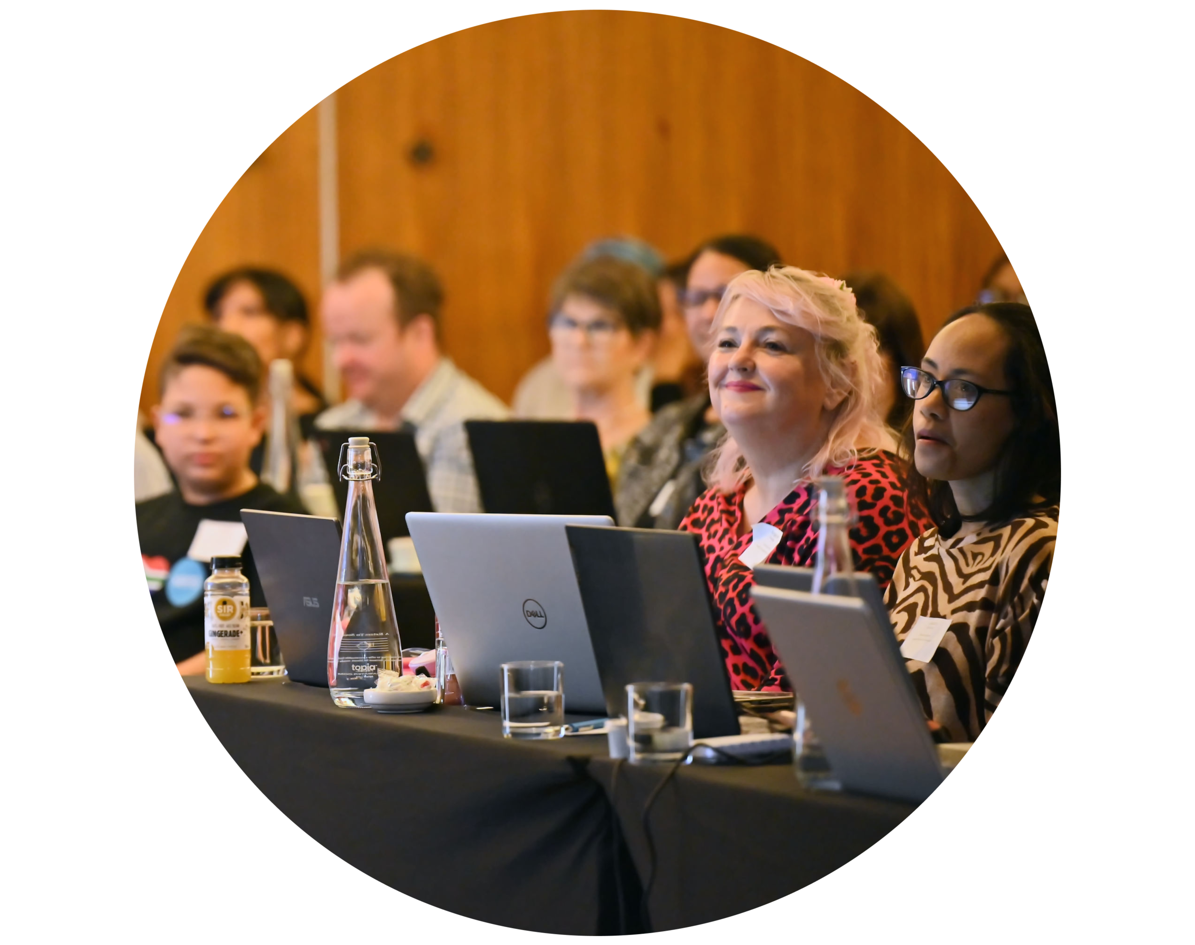 A group of students sit in a lecture theatre, taking in a lesson on cloud-based accounting software.