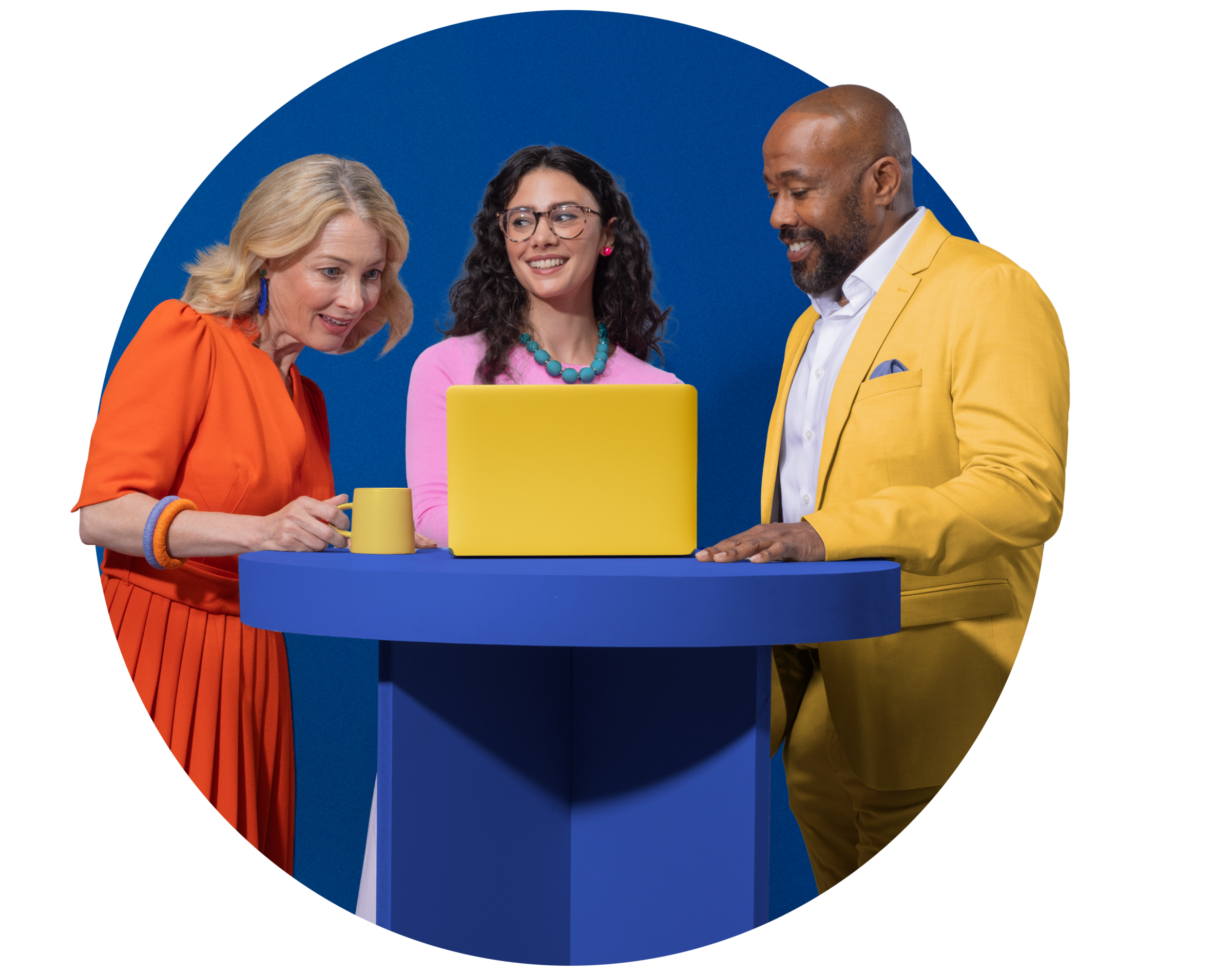 Group standing round a laptop conversing