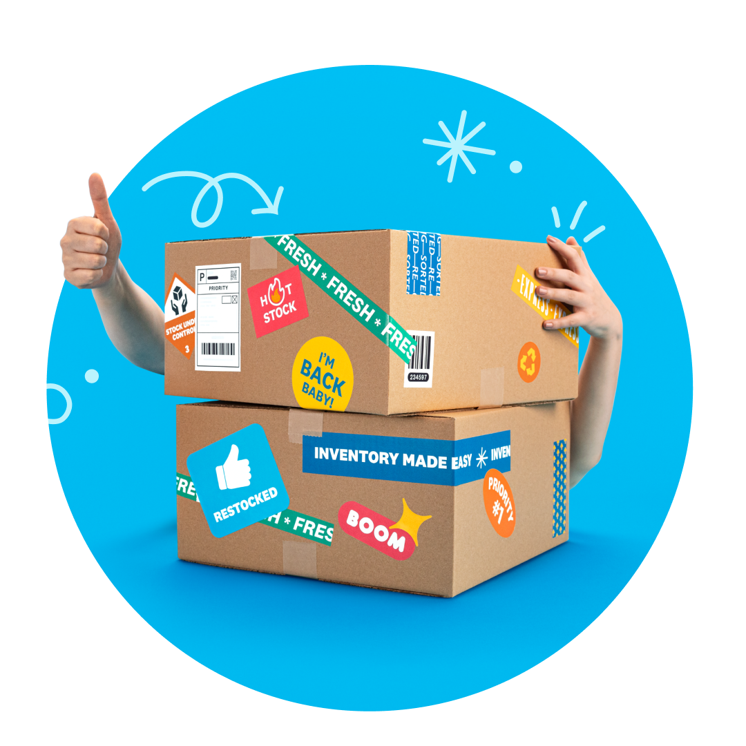 A happy business owner, hidden behind a box covered with shipping stickers, gives a thumbs up