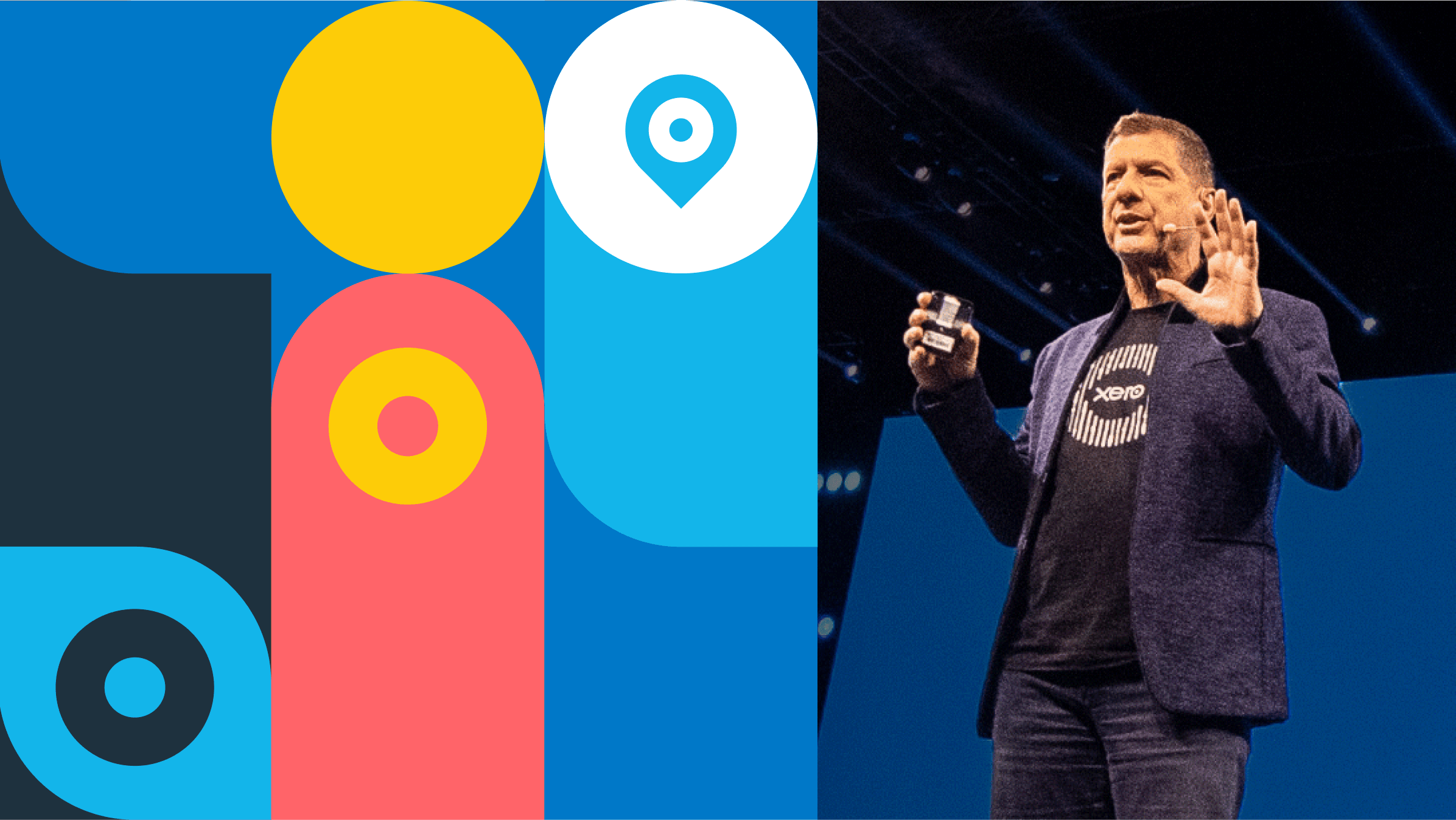 A presenter in a Xero t-shirt uses a remote control to operate a slide show. In the background is a colourful Xerocon graphic